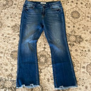 Like new KanKan boot cut jeans. Distressed bottom of legs